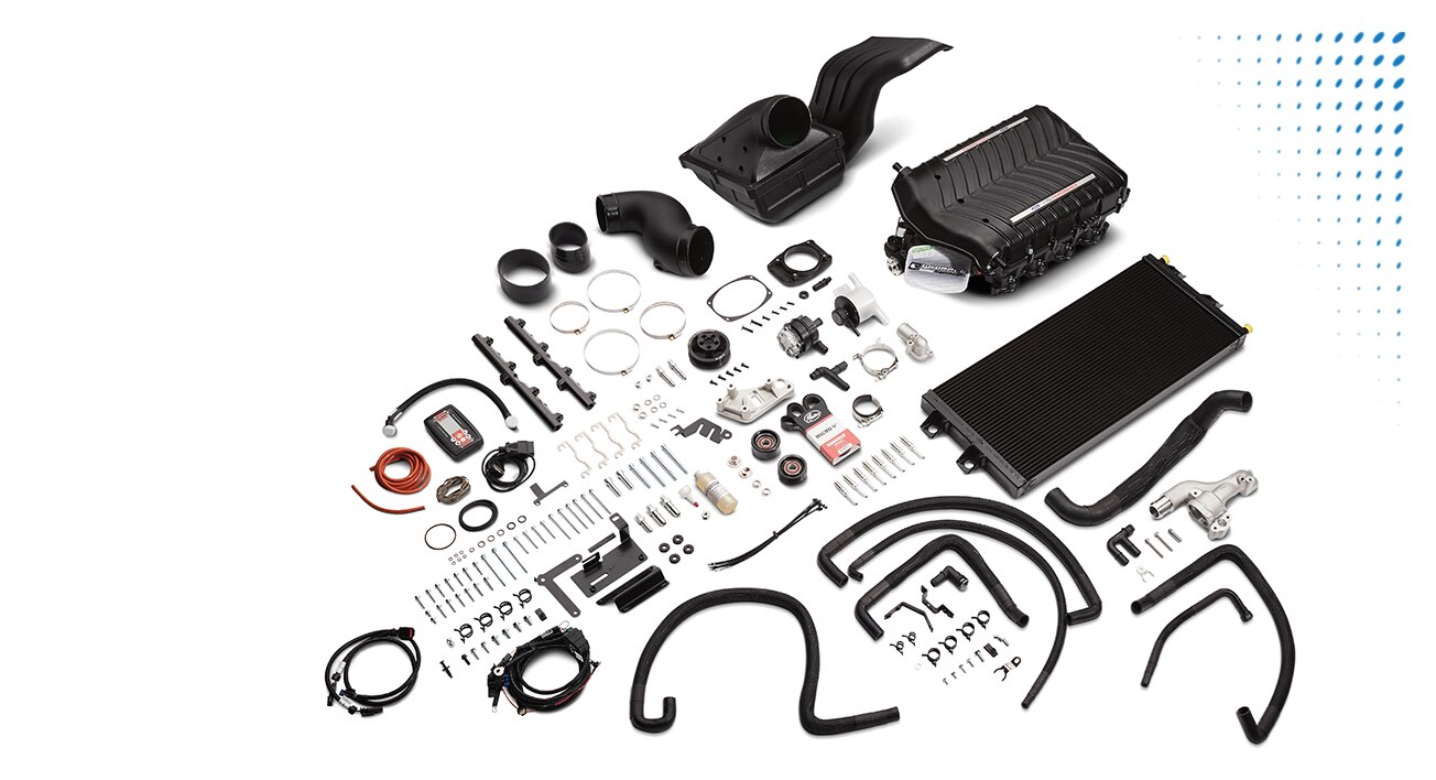 An assortment of Ford parts on a white background.