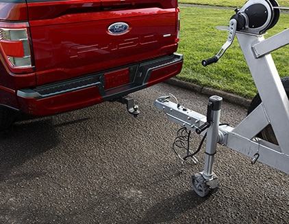 A parked Ford F-150 with trailer hitch.