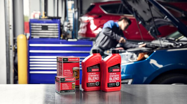 Motorcraft motor oil and oil filter products on shop table.