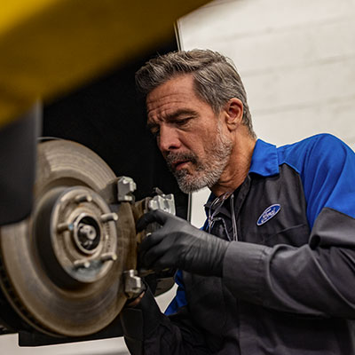 Technician working on brakes