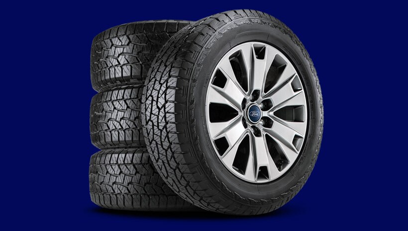 Four tires on blue background