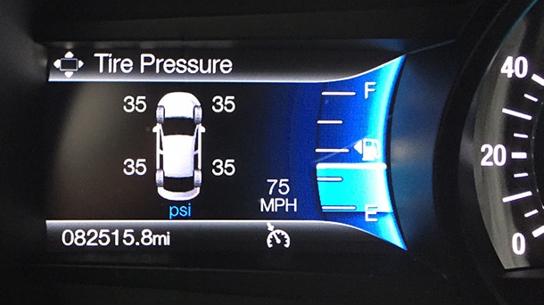 Vehicle digital display showing pressure levels of its tires