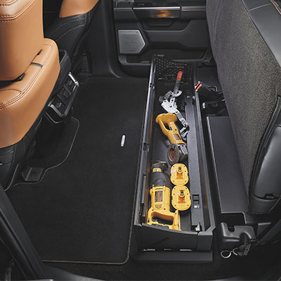 Power tools stored under the seat