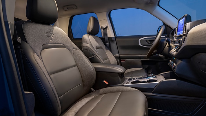The comfortable interior of the Bronco Sport® SUV shown from the view of the passenger side seat.