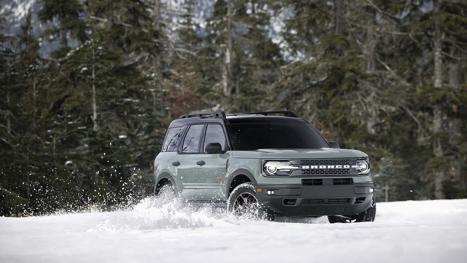 A Bronco Sport® SUV plays off road in the snow.