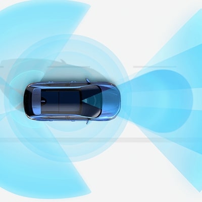 A photo illustration of a Ford Edge® SUV with blue sensor ranges shown around it on a white background.