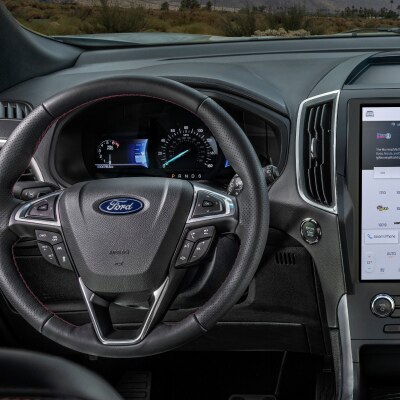 View of the steering wheel and instrument panel of a 2023 Ford Edge® SUV.