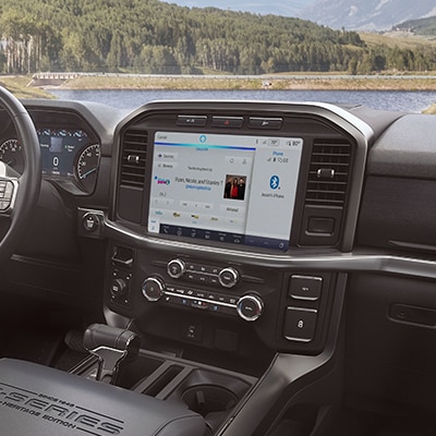 The center console of a 2023 Ford F-150® truck displaying the vehicle technology touchscreen content, which may vary.