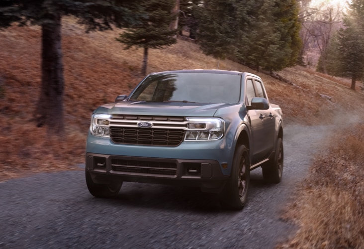 2022 Ford Maverick driving on a country road.
