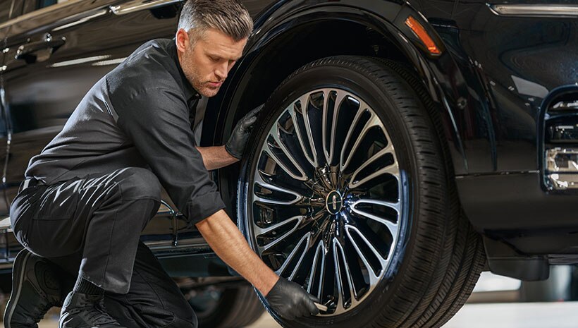 Service Technician with tire