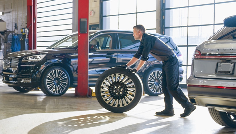 Service Technician with a tire