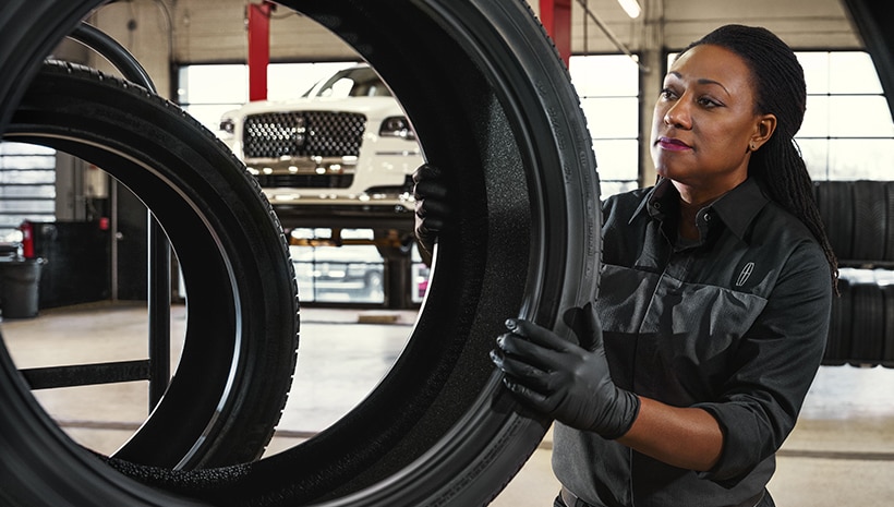 Service Technician with a tire