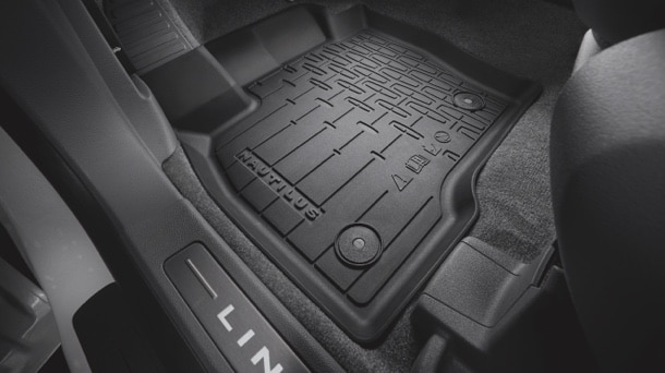 A floor mat is shown inside a Lincoln® vehicle