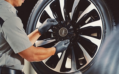 Service technician with a tire