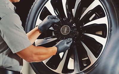 Service Technician with a tire