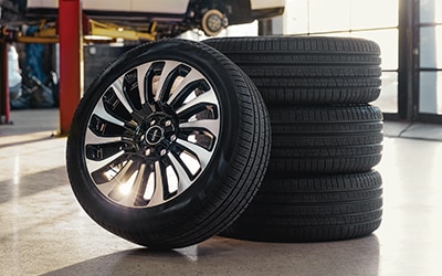 Tires stacked nicely in a service bay.