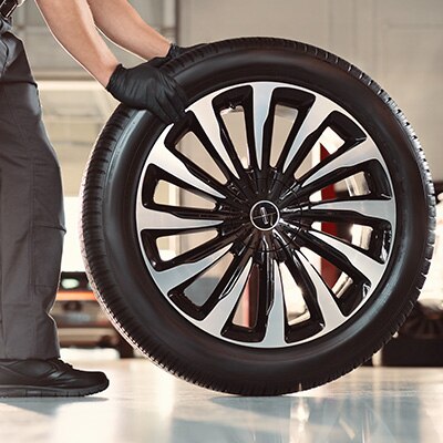 Lincoln technician with tire