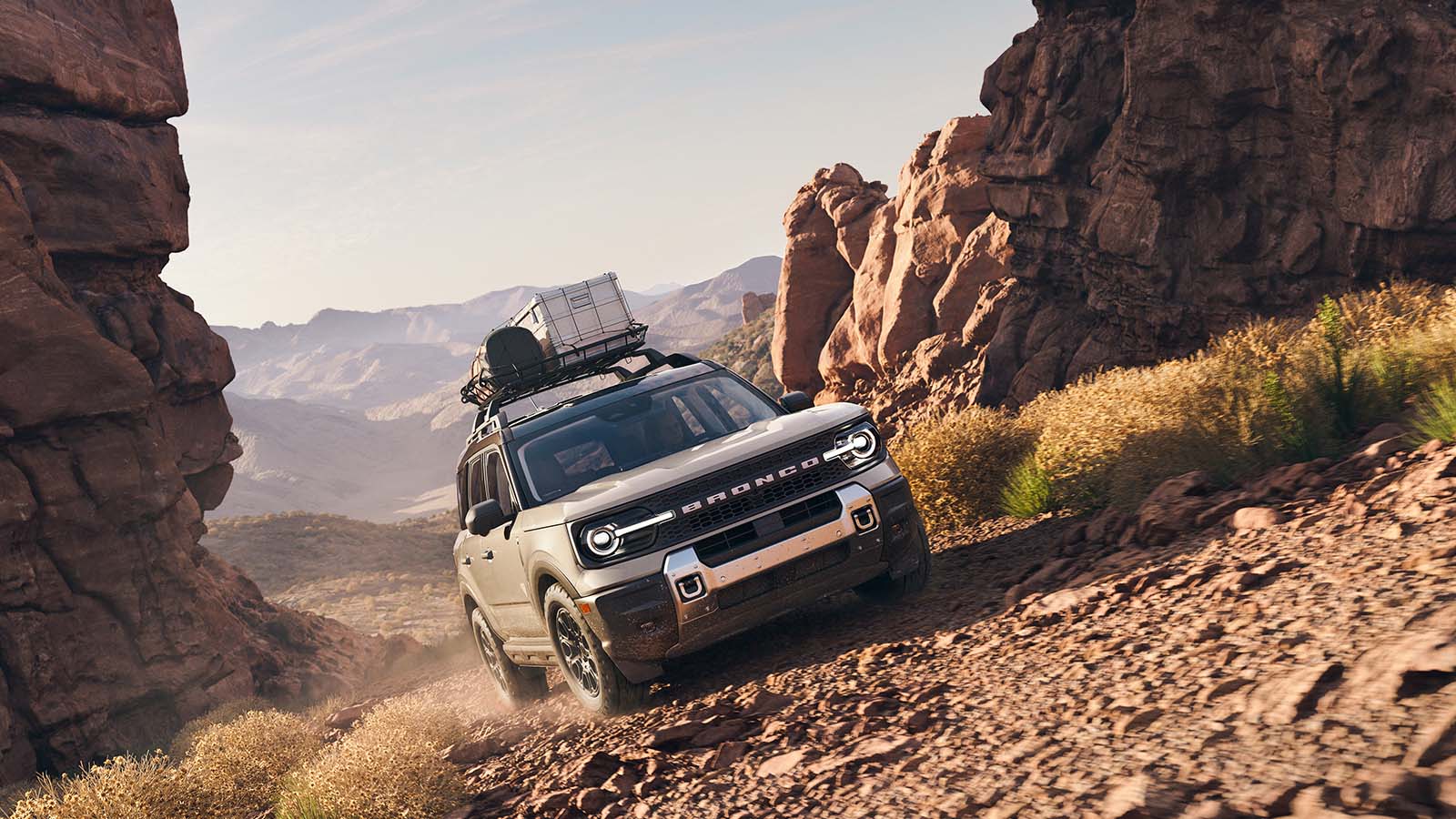 A Bronco Sport® SUV plays off road on a rocky mountain passage.