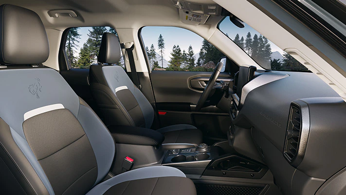 The comfortable interior of the Bronco Sport® SUV shown from the view of the passenger side seat.