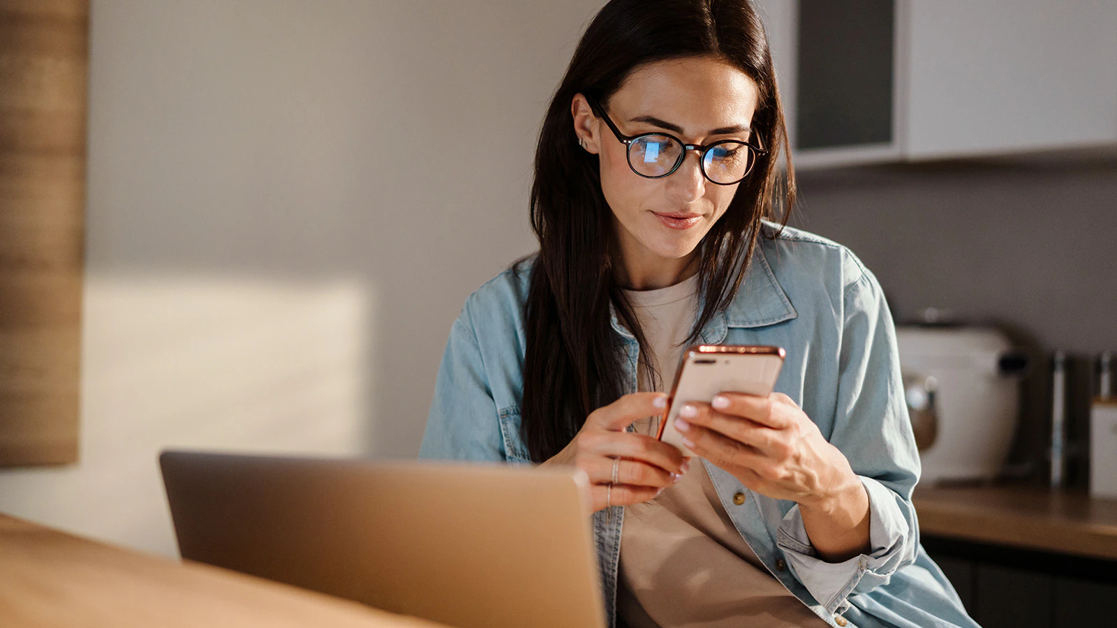 A Mach-E® owner checks their FordPass® app from the comfort of home.