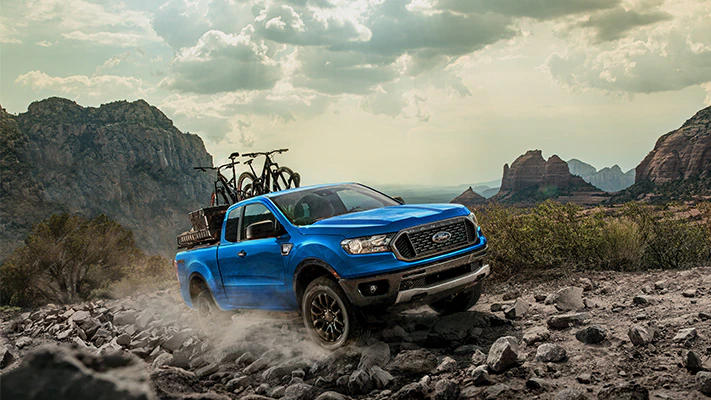 The Ranger® pickup loaded up with bikes and a cooler searches for an off-road adventure.